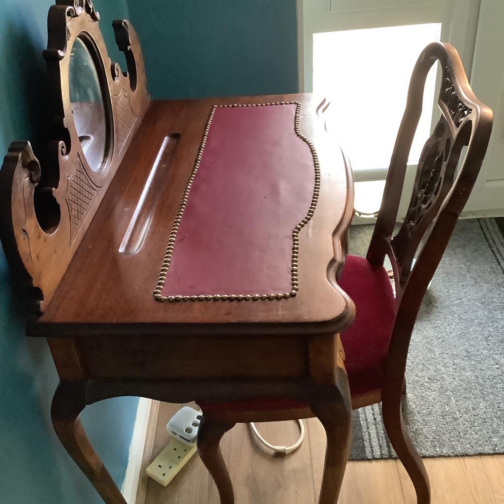 Table/ desk with chair. Ornate wood with red leather top and red velvet chair seat.