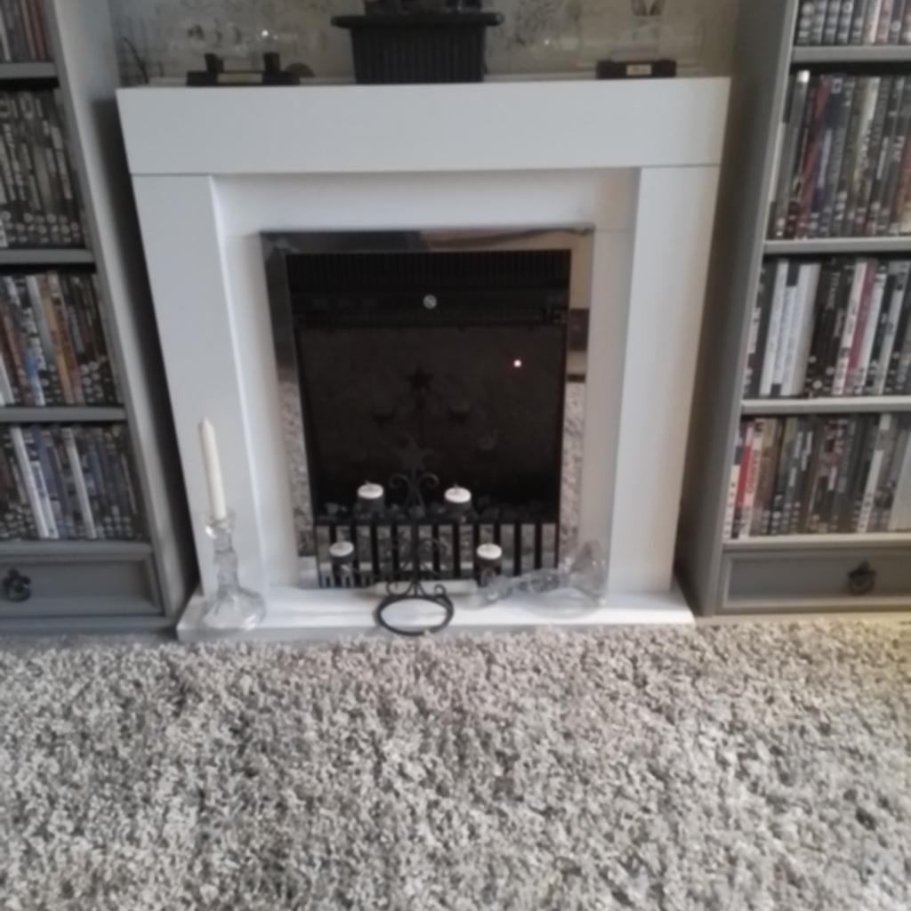 White electri fire suite ,with remote control and living flame the reason I'm selling is cuz I've changed my colour design it cost me 375.00 I want 150.00 pound and collection only