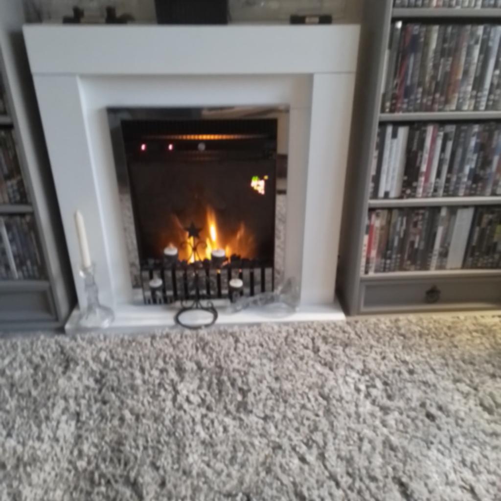 White electri fire suite ,with remote control and living flame the reason I'm selling is cuz I've changed my colour design it cost me 375.00 I want 150.00 pound and collection only