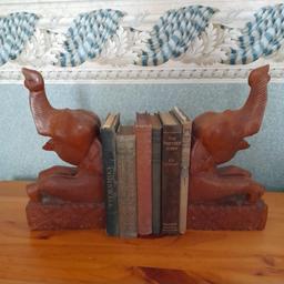 Vintage Carved Wood Bookends in the form of Elephants 🐘
*When I purchased these I asked about the missing tusks - apparently they were removed prior to sale to comply with UK laws regarding Ivory (even though the dealer suspected they were actually bone*
Lovely Condition & a good solid weight
(Seen identical pair on another website for 3 times my asking price!)

**Postage possible at buyer's expense with payment by PayPal please so buyer protection will apply 