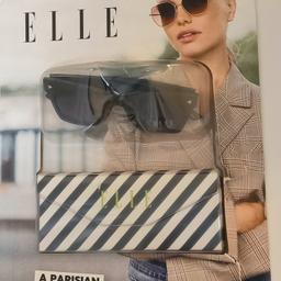 New Elle Women’s Sunglasses in a sleek black frame which provides maximum protection against harmful UV rays while maintaining clear visibility. ELLE logo on the frame. Box is torn.