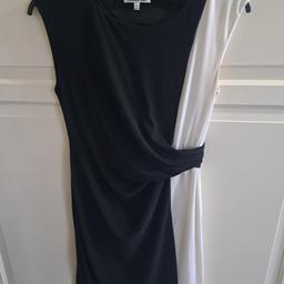 Ladies black and white mid length dress. 
Stretchy material. 

From Debenham 

Side zip fasting. 

In good used condition. 

Collection from TW13 or post at extra cost. 

From a smoke and pet free home

£5
