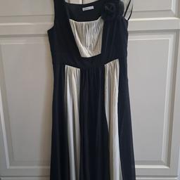 Ladies Black and off white dress. 
3/4 Length. 

Has flower design on shoulder. 

Worn once of a wedding. 

Size 12

Collection from TW13 or post at extra cost 
From a smoke and pet free home 

£10