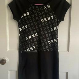 Girls knee length #DKNY Dress with Zip pocket detailing 

Size: 14 years (better suited to age 10-12 years)
Length: 76cm
Colour: Black, white 

Condition: in very good #likenew condition. Only worn twice and still looks great 👍