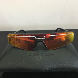 Model BB0003S - 2023 sunglasses collection . 
007 ( Black/orange mirror lenses.
Only worn on holiday for a few weeks in immaculate condition. Comes with original Balenciaga case. Bought for £349
Delivery via Royal Mail signed for.