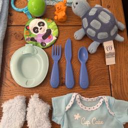 Baby dolls accessories bundle 
Blue items for a baby boy doll 
Includes:
Soft feel blue blanket with teddy bear motif 
Fluffy blue booties 
Hand knitted blue and white cardigan 
Feeding plate with cutlery utensils
Baby GAP Interactive tortoise which laughs & giggles 
Fisher Price sensory toys X 2 
Cute little brown bear 
Cup cake t shirt 

All in very good washed clean condition 
From a smoke free pet free home 
Listed on multiple sites