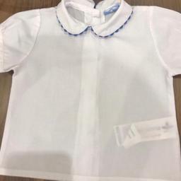 Age 3 months SARDON Spanish designer baby clothing.
Pretty little top
High quality Spanish clothing
White with blue piping around the collar, buttons at the back.
In excellent clean condition
Hardly worn- just outgrown
From a smoke free pet free home
