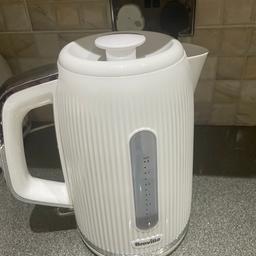 White and silver kettle. Very stylish in any kitchen like new hardly used. Comes from a smoke free and pet free home.