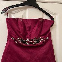 Soft stretchy satin look fabric.pretty jewel stones under the bust.fully lined with zip fastening at the side.also comes with straps.size 10 lovely quality from Oasis new with tags on