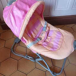 GRACO Girls Baby bouncer. Has a hood which is great for outside, keeps the sun/wind off. Hydro suspention. Folds up flat and small. Has a convient pocket at the rear. New batteries included. Vibrates. 
Photo 4 I have reinforced  one of the seams.
