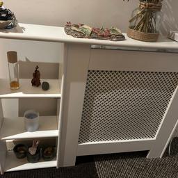 White radiator cover with 3 shelves. Dimensions as per picture apart from width- the width in total is 106cm including shelves, the part covering the radiator is 73cm. Only selling as want something smaller without the shelves. Already assembled. RRP £69 from B&Q. Preferably for collection please