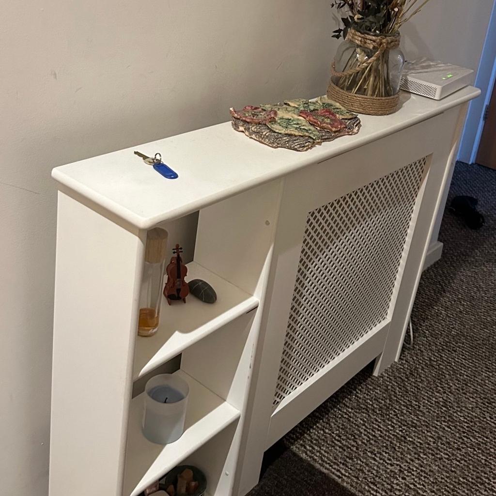 White radiator cover with 3 shelves. Dimensions as per picture apart from width- the width in total is 106cm including shelves, the part covering the radiator is 73cm. Only selling as want something smaller without the shelves. Already assembled. RRP £69 from B&Q. Preferably for collection please