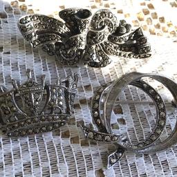 3 beautiful Vintage brooches set with marcasite stones
Two have the word silver stamped on back,as seen in photographs .Crown brooch has no stamp that I can see
All three sold together £12 o n o