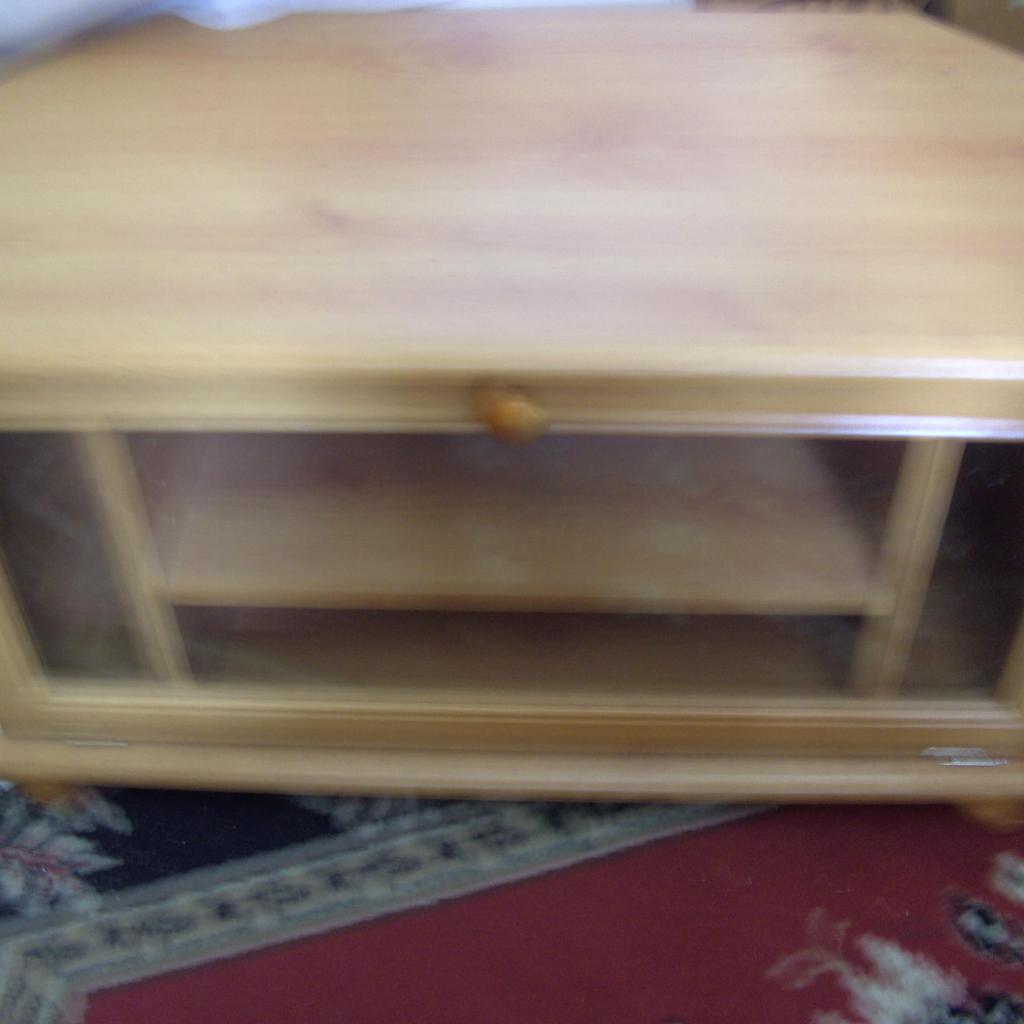 wooden tv stand with glass front measuring 75 cm long 40 cm wide 43 cm height