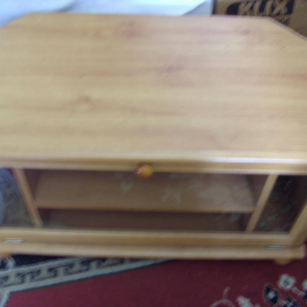 wooden tv stand with glass front measuring 75 cm long 40 cm wide 43 cm height