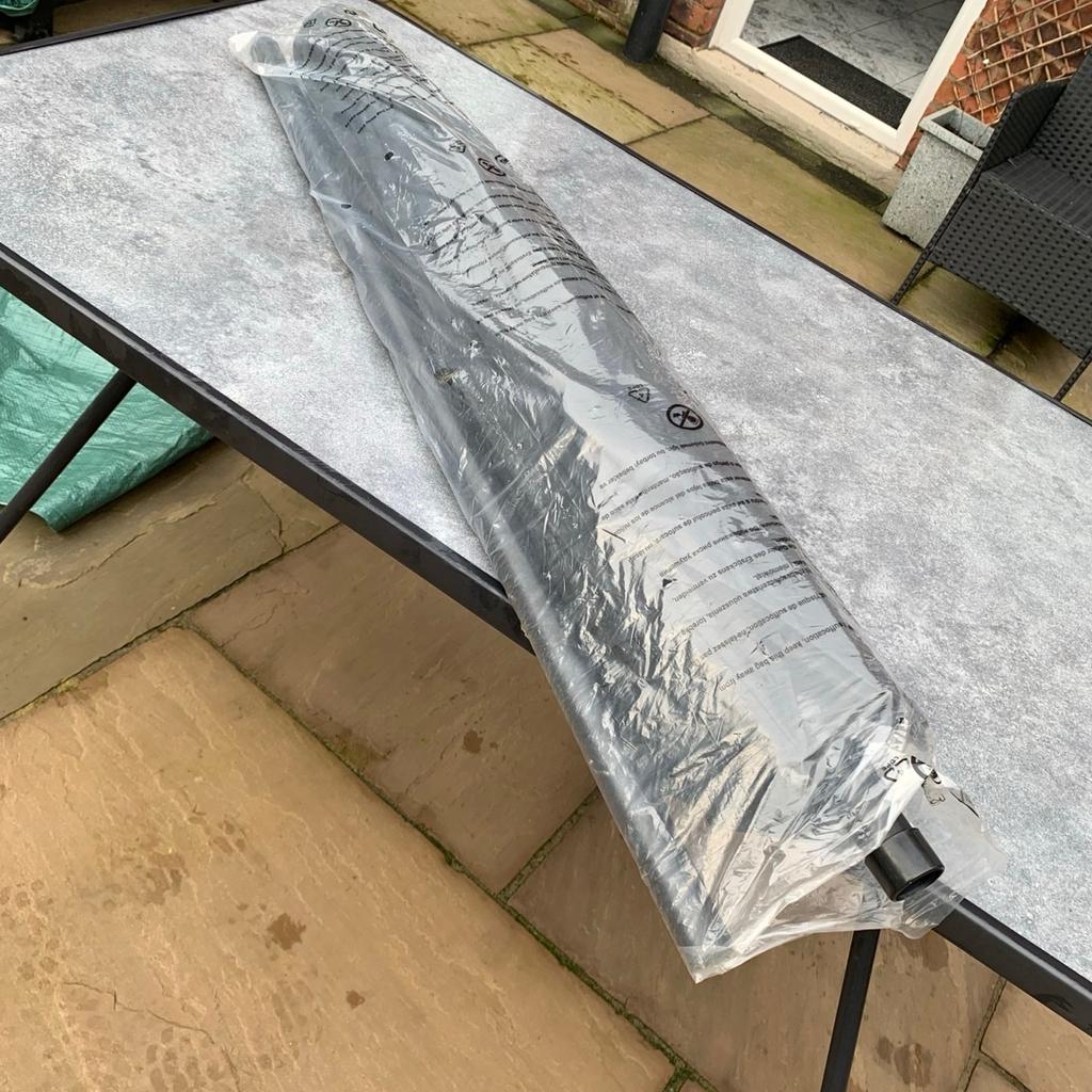 Large rectangle garden dining table with faux marble effect top and parasol hole. All-weather metal frame. Assembled but never used, together with 6 x black mesh chairs (still in packaging, only removed for photo purposes), large wind up black parasol never used (still in packaging, only assembled once for photo purposes) and 8kg parasol base still boxed never opened. Excellent new condition. Ideal for summer garden parties 😁 buyer must be able to collect and pay cash or bank transfer on collection. I’ve no doubt this will be snapped up 😁