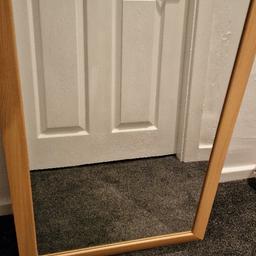 Wall mirror light brown frame

In good condition its a heavy mirror, got slight black marks on one side in side glass see picture.

Size
Long- 64.3 cm
Width- 33.8 cm