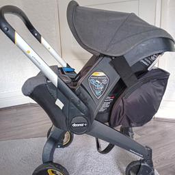 Used Doona pram,  includes  accessories - Raincover, black storage bag which clips on the back, and a seat cover to protect the car seat. has quite a few scratches on  bottom legs of pram which can be seen in the photo, other wise still in good use.