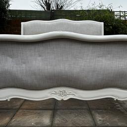 This stunning & quality Sweetpea and Willow Raffaella French upholstered style super king size Bed-frame is in great used condition overall, apart from the stains /marks on the headboard which can either be professionally cleaned and recovered but the rest is in decent condition with a few minor chips, dents, scratches, and nicks, that had some touch ups and add to the shabby / distressed chic character. Still a magnificent set to own. Please see pictures

The beautifully hand carved French Bed was handcrafted from solid wood and completed in a stunning white colour in a distressed finish, with intricate carvings and etched feet.   

W: 195cm

L: 222cm

Headboard height: 145cm

Footboard height: 95cm

This will fit a standard super king size mattress of 6FT

Collection from Sunbury
