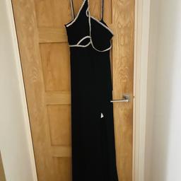 Worn once like new. Black maxi dress with twisted crystal straps. 95% nylon and 5% spandex. Ideal for a wedding, corporate event or evening out. Selling due to being a little too small to fit into now :) Was £300 looking for quick sale