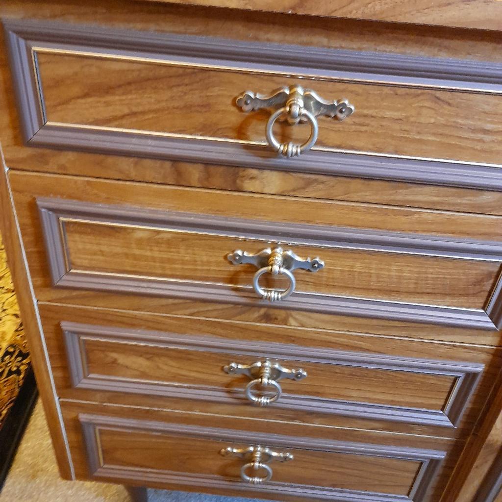Light Oak sewing machine cabinet with 3 draws and lift up lid on top. It has 2 consatina doors and inside a shelf with macanical lift for your sewing machine. Immaculate condition, no marks or scratches. Size 40 inches long by 18 inches wide. Bargain price for quick sale need the space.