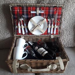 Beautiful Picnic Hamper Basket. Includes black picnic blanket, bottle of red wine, 2 wine glasses, 2 mr & mrs tumblers, 2 mugs, plates, bottle opener and cutlery. Never been used. Sadley just gathering dust in the cupboard. Would love it to go to a new home where it will be appreciated. Approximate size 46w x 30d x 20h. Collection Only. B90 4XA. No Returns or Refunds. Urgent collection advised as item remains for sale till payment is received.