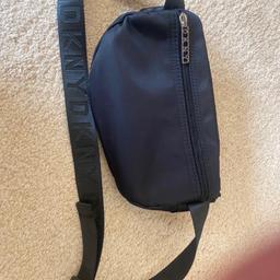 New GENUINE DKNY bum bag. Has adjustable strap. Never been used. Great for festivals / holidays /gym . Collection only