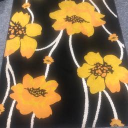 47 inch by 68inch rug 
Brown and orange flower rug 
Good quality
