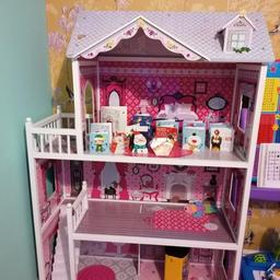 A beautiful barbie house in a very good condition. Comes with a lot of furniture and barbie dolls+outfits. From a smoke and pet free home.