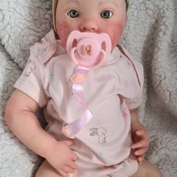 I have forsale beautiful reborn baby doll. she is new handpainted with genesis heat set paints.  very durable. she has lovely big green eyes. handpainted hair. magnetic dummy and is weighted. 
will come well packed in her outfit with dummy and clip.