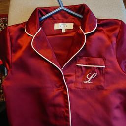lovely satin style pyjamas
Embroidered L on pocket
granddaughter outgrown them
still in very good condition