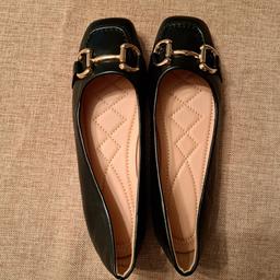 Never worn. Decorative metallic bar front loafers. Black. Size 6