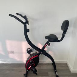 Folding exercise bike. Hardly used like new. Size H116, W42, D86cm. The screen of this bike shows seven different display functions so you can track your progress during each workout. When you're finished, this bike folds for easy storage. Adjustable seat. Self levelling pedals with pedal straps. 8 level tension control.