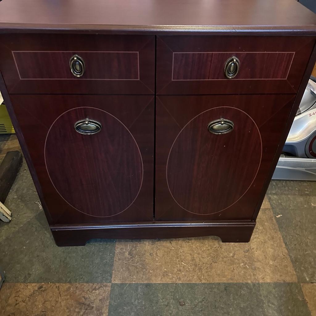 Hall alcove cabinet , red mahogany effect , 2 doors , shelving inside , odd marks , sizes in cm w 70.5 ,d 27 , h 74 , can be delivered locally for a charge , 07784859403