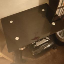 Glass computer table with casters. easy move around the room.