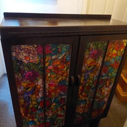 Dark wood beautiful antique cabinet with key.
stickers on windows can be removed.