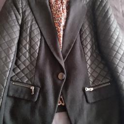 ladies jacket size12/14 has been worn a few times slight damage on one sleeve as seen in pictures can't notice when wearing looks fab on colour is black and grey
