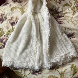 White knitted christening cape with hood.
Edged in ribbon and lace. Length 50cm from neck.
To fit baby up to 6 months.
In good condition from non smoking home
Buyer to collect from Bingley.Will deliver if local.