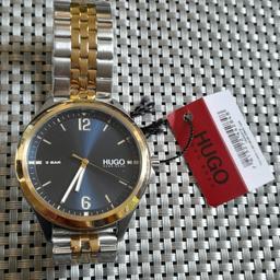 Hugo Boss Men Analog Quartz #Suit 2-Tone Bracelet plated Watch 1530219

New with tags but NO box

Model number	1530219
Model Name #Suit
Model Collection Business
Dial Window Material Type	Glass ( mineral )
Display Type	Analog
Clasp Type	Push Button Deployment Clasp
Case Material	Gold Plated & Stainless Steel
Case Diameter	44.9 mm
Case Thickness	8.2 mm
Band Material	Gold IonPlated & Stainless Steel
Band size	Mens Standard
Band Width	20 millimetres
Band Colour	Silver
Dial Colour	Blue sunray
Bezel Material	Gold IonPlated & Stainless Steel
Bezel Function	Stationary
Hour Markers Batons
Special Features	Water Resistant
Weight	115 gr
Movement	Quartz
Movement Source Japan

3-hand Quartz Movement
Case thickness 8.2mm/Case Diameter 44.9mm
Blue sunray dial and circular brushed outer ring
The dial exhibits gold baton and Arabic indices with gold hour, minute and second hands
Two-tone stainless steel and Light Yellow-Gold Ion Plating (IP) bracelet

#startfresh

Ion plating is also known as PVD