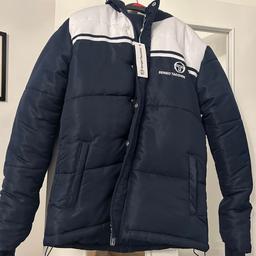 Men's Sergio Tacchini Parker brand new with tags on bought for my Son but it was too big for him. It's brand new with tags on & has never been worn, beautiful Jacket. Cost £290.00 Brand new but I can't find receipt to take it back.

This is a very rare Jacket very hard to come buy.