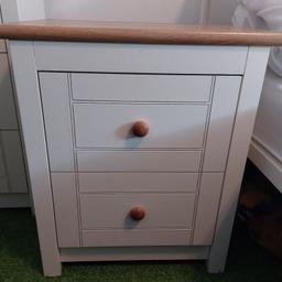 Cream Coloured Bedside Cabinet with oak top and handles. Like new. Collection only. Matching items available: Single Wardrobes, Tall chest of Drawers and Standard Chest of Drawers.