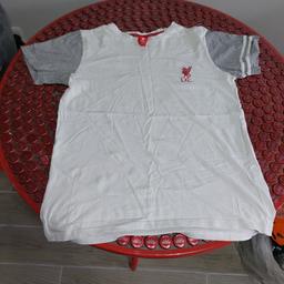 Liverpool FC t shirt.
Would fit child aged 10-12