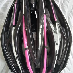 Muddyfox cycle helmet . Black and pink. Medium 54/60 CMS. Worn very little.  As new. Collection only