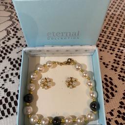 Eternal collection 
Mixed coloured pearl effect bracelet with matching earrings for pierced ears