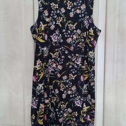 Gorgeous floral sleeveless dress. Size 22. Has some stretch so comfy to wear. Midi length. Zip at back. In good worn condition. Plenty wear left. Gr8 dress for your spring/summer wardrobe. Wld look good with short black jacket and heels.
