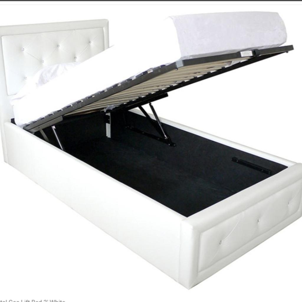 Brand new still in box
GFW Hollywood crystal gas lift Ottoman Bed
• White faux leather 3ft (90cm) single
• Diamante crystal embellishments
• Attractive cross stitch detailing
 •Modern and low priced
 •Sprung slatted base
•Width: 105 cm × Length: 206,5 cm × Headboard Height: 109 cm × Footboard Height: 36 cm