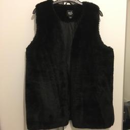 New fur gilet. Looks lovely with jeans and boots. Size is girls size 14-15 year old.
