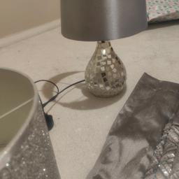 Hiya

i'm selling these beautiful home accessories due to redecorating

There is a beautiful sparkly silver lamp shade 

A bedside lamp with mirror work and a set of sparkly silver and grey curtains (average size window)
