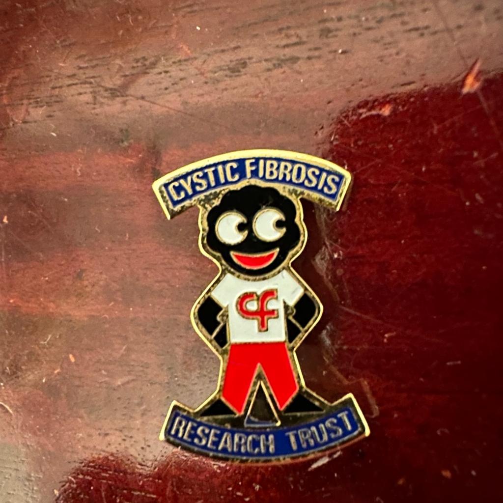 A genuine Cystic Fibrosis badge. From the 1980's era. This is one of the more difficult of the Acrylic Special Promotions to find. Issued in 1987 as a joint venture between Robertsons and the Cystic Fibrosis Research Trust, a limited edition of only 2000 were made but they were not distributed by Robertsons. They were only available from the CF Research Trust. Many of these items ended up in the hands of non-golly collectors which is why they are so difficult to find today. Stamped with James Robertson & Sons.