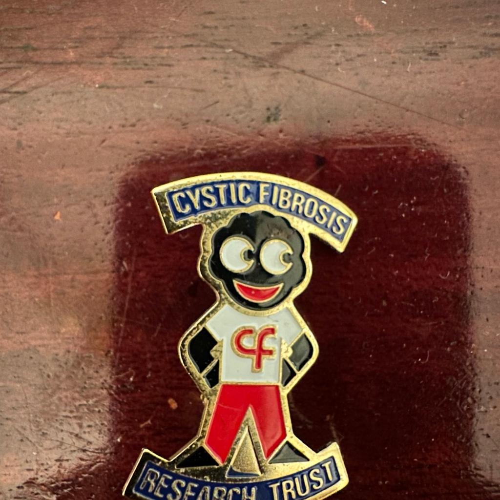 A genuine Cystic Fibrosis badge. From the 1980's era. This is one of the more difficult of the Acrylic Special Promotions to find. Issued in 1987 as a joint venture between Robertsons and the Cystic Fibrosis Research Trust, a limited edition of only 2000 were made but they were not distributed by Robertsons. They were only available from the CF Research Trust. Many of these items ended up in the hands of non-golly collectors which is why they are so difficult to find today. Stamped with James Robertson & Sons.
